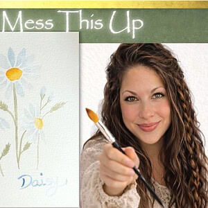 Daisy Watercolor tutorial for beginners, reluctant artist, anyone can do it two colors yellow and blue, holding a paintbrush with daisys in the middle