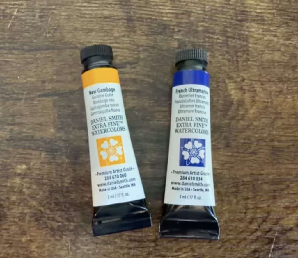 new gamboge and french ultramarine watercolor tubes by Daniel Smith used for the easy watercolor daisy tutorial. 